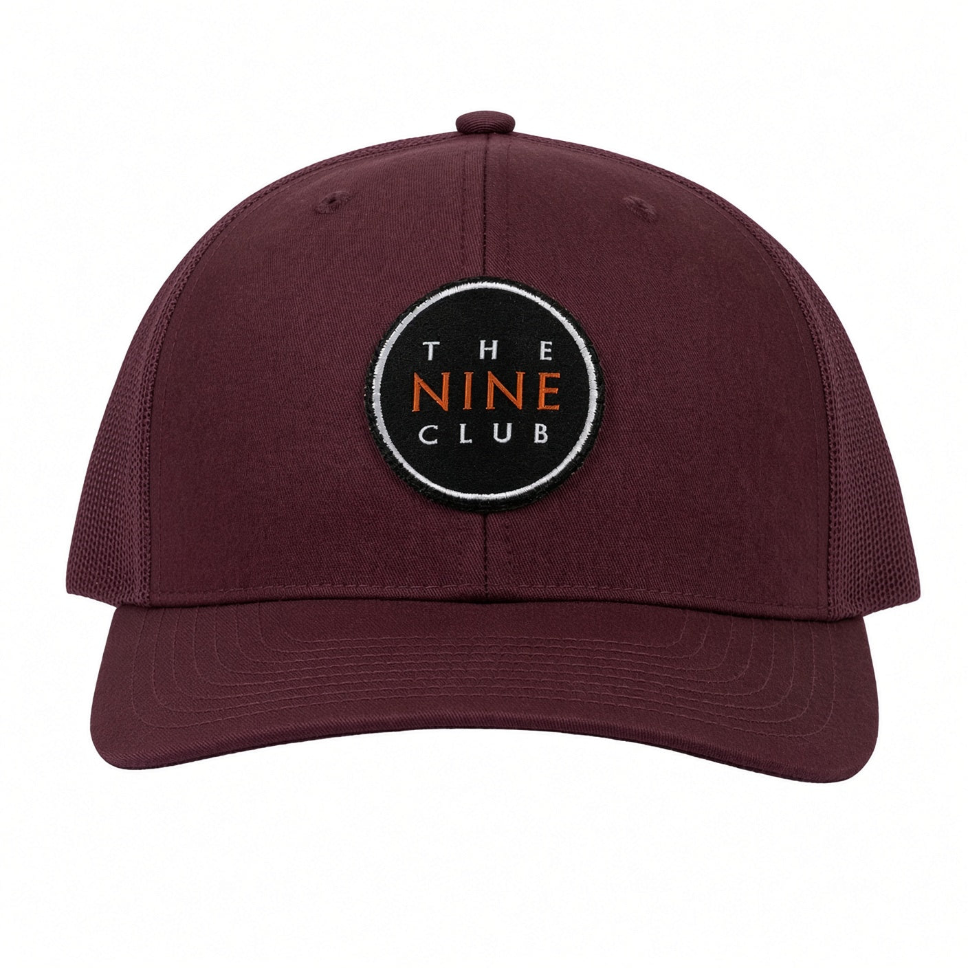 OG Logo Maroon Patch Trucker Hat, all-maroon trucker with black round The Nine Club patch, front view