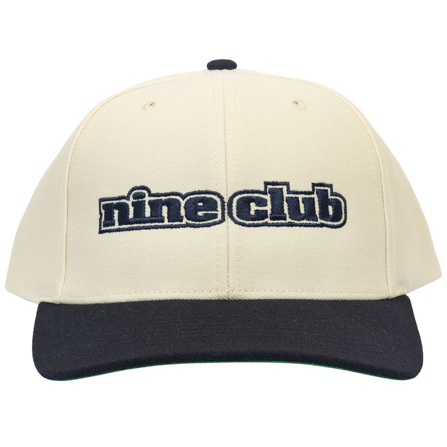 The Dupe Birch/Blue Hat, cream crown with navy brim and navy nine club embroidery, front view